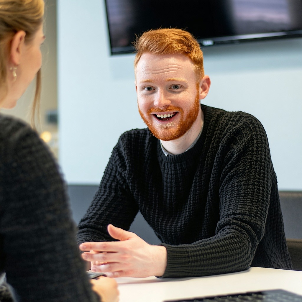 Irish digital marketing manager talking with a colleague